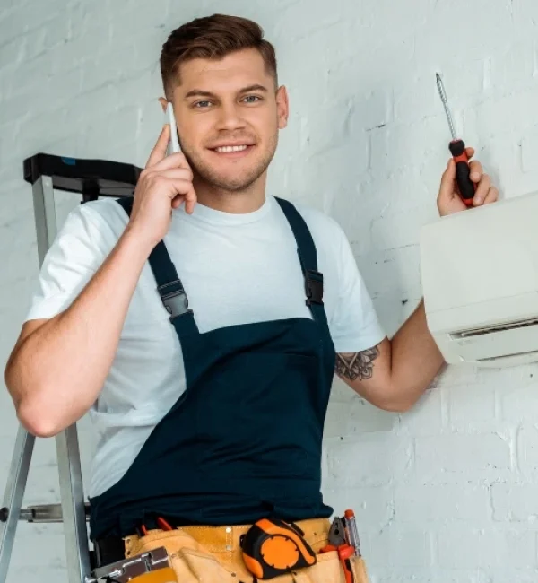 happy-installer-holding-screwdriver-while-talking-N5SBRZL-1